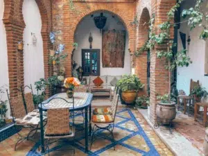 Best Moroccan Riads: Experience Authentic Moroccan Hospitality in Style brown wooden table with chairs